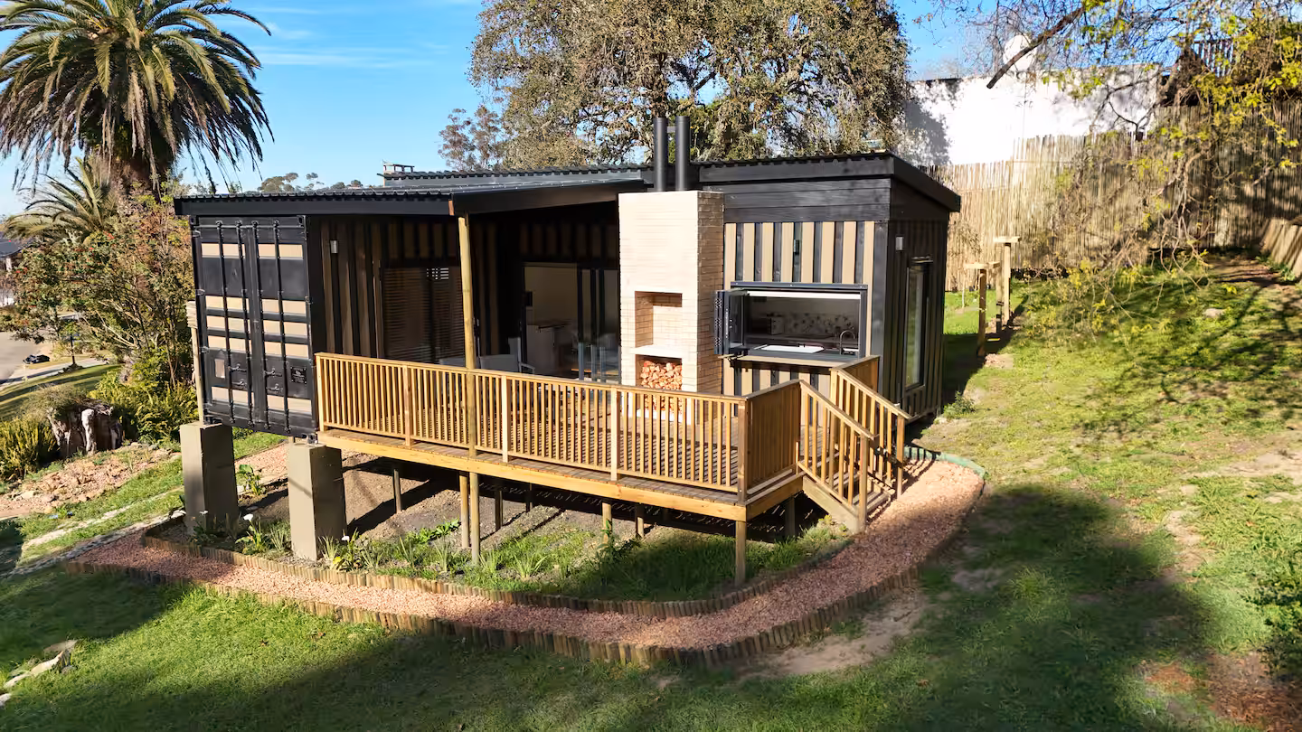A tiny house at The Hide in Swellendam, raised on a deck with a built-in braai