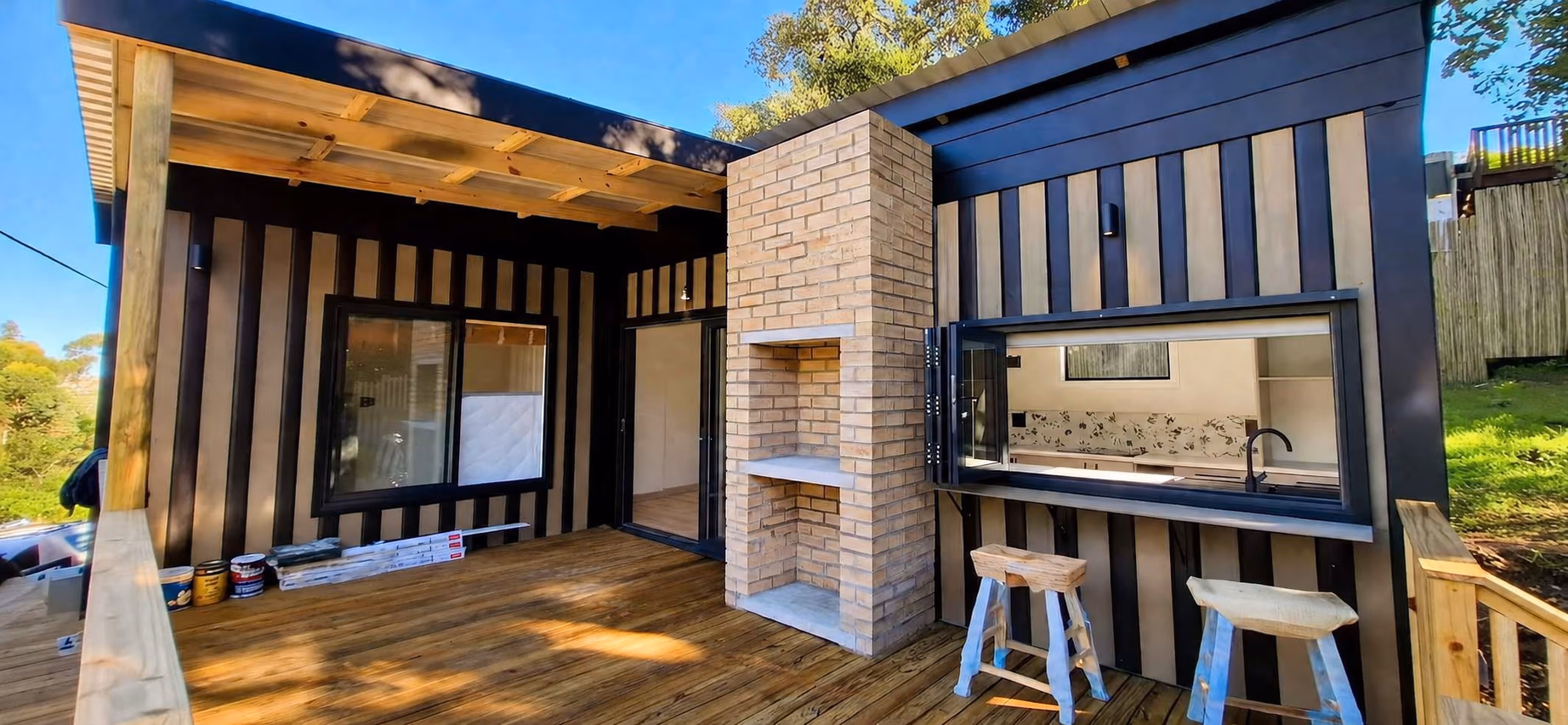 Rudi and Tish's outdoor deck and built-in braai, finished in dark cladding
